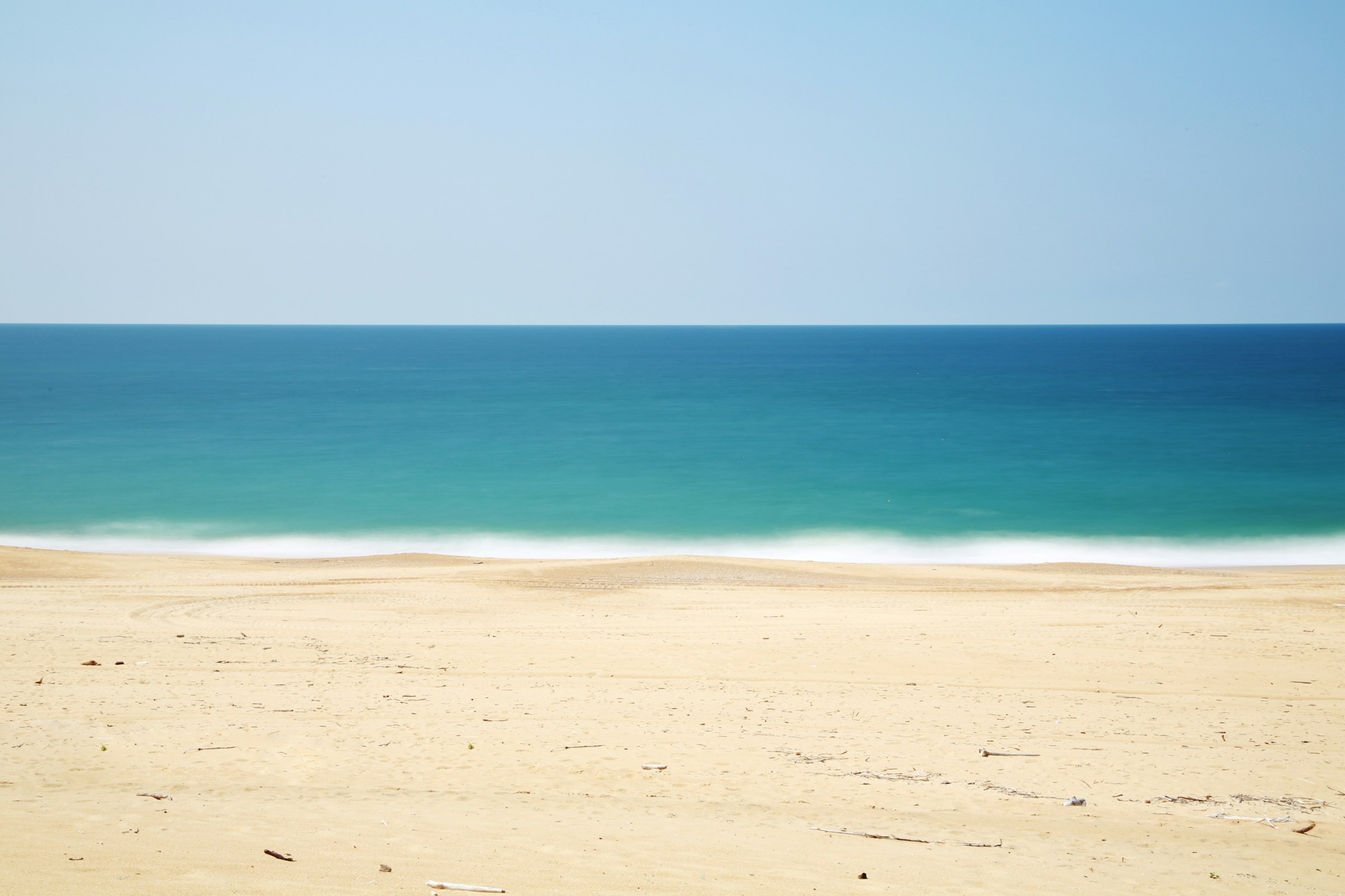 Wide calm beach and ocean view
