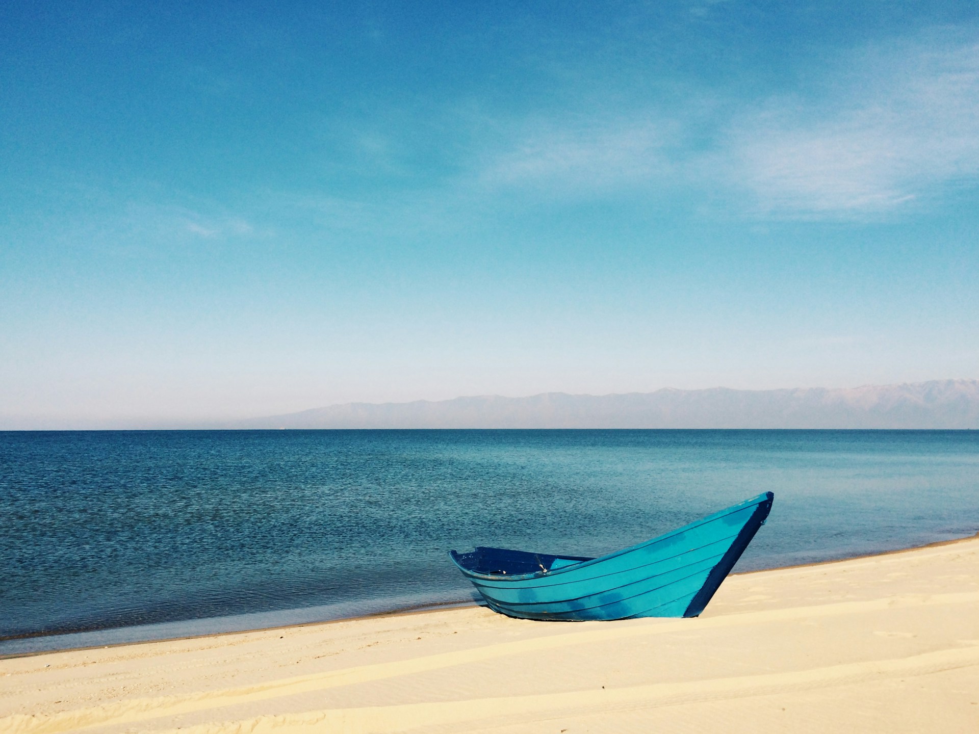 Boat resting near peaceful ocean water